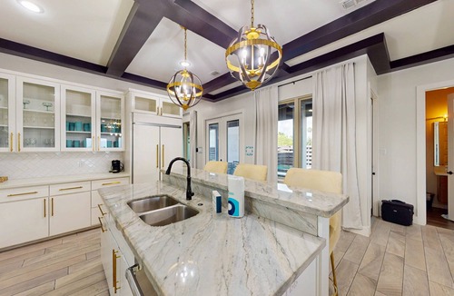 Port Isabel House | Stunning waterfront home with private pool, gym, & grill - steps to sand & SPI