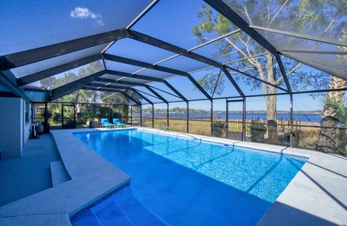 Riverview House | Super Mario's Riverside Hideaway: Unique Family Fun with Pool & Games