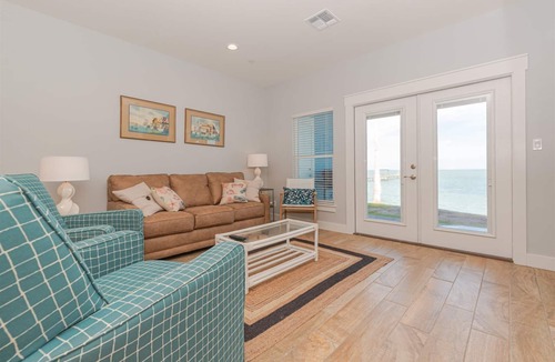 Rockport Condo | Sweeping views of Copano Bay from this newly constructed ground floor condo with a pool and a new fishing pier!