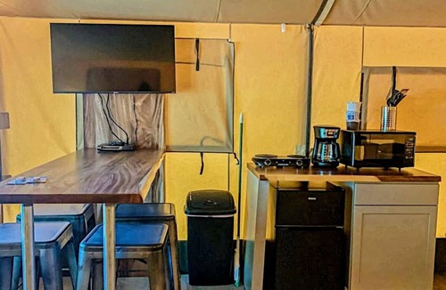 Fentress RV Rental | Texas Creekside Safari Tent Glamping Perfect for Nature Retreats for Water Sports Enthusiasts