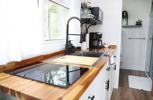 Mingoville Cabin | The Bellefonte Campground presents: The Luxury Hideaway Container Home, hot tub, Rooftop veranda, and more.
