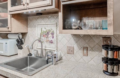 Maple Ridge Apartment | The Teak Follow, beautiful brick enclosed space