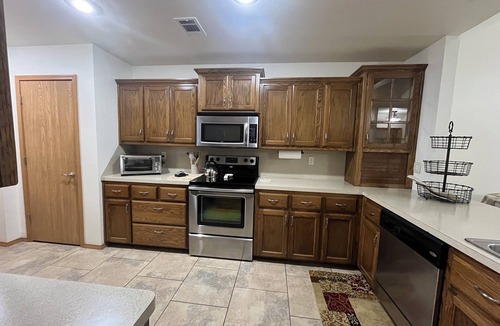 Spiro House | Upscale home with high end furnishings and memory foam king bed. 2 car garage