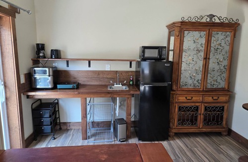 Fernandina Beach Apartment | Walk to the beach. Two room suite & shaded deck with sunset views over greenway.