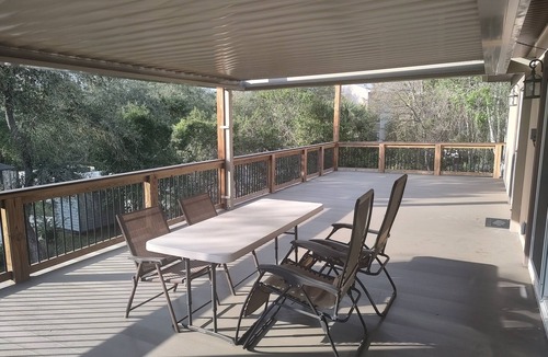 Fernandina Beach Apartment | Walk to the beach. Two room suite & shaded deck with sunset views over greenway.