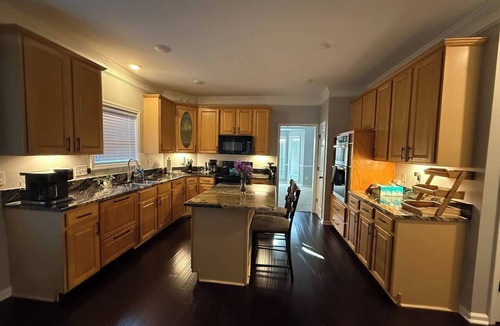 Greensboro House | Welcome to The Clover, a spacious 2-story vacation home that blends charm with modern comfort. Perfect for families, friends, or groups, this cozy retreat features inviting living spaces, a fully equipped modern kitchen & comfortable bedrooms.