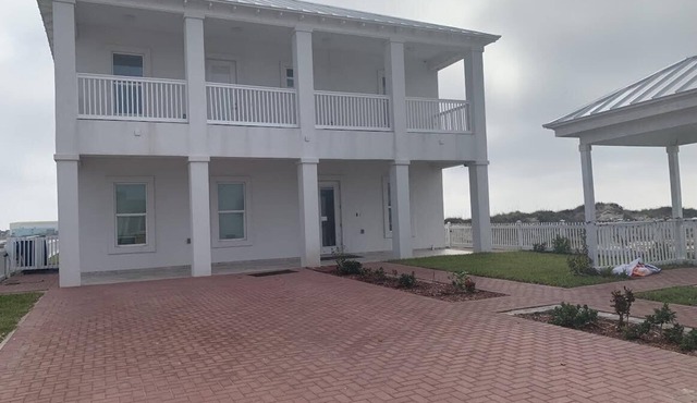 beautiful condo on the bay with beach access and a beautiful pool
