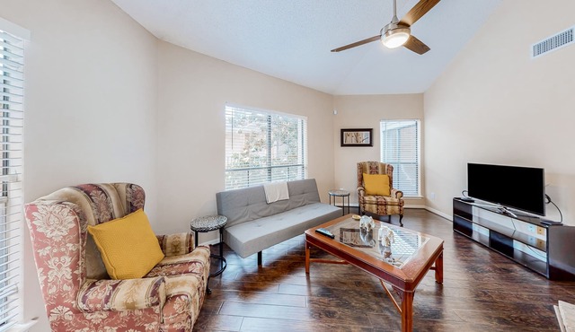 Conveniently located condo with on-site pool, private balcony, AC, & W/D