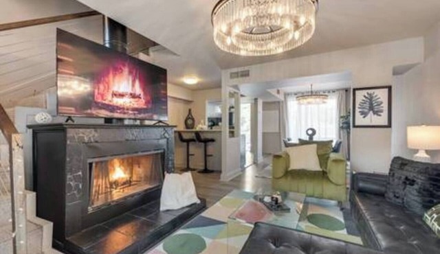 Cozy 2-story loft with fireplace, luxury linens, full kitchen, and award-winning courtyard.