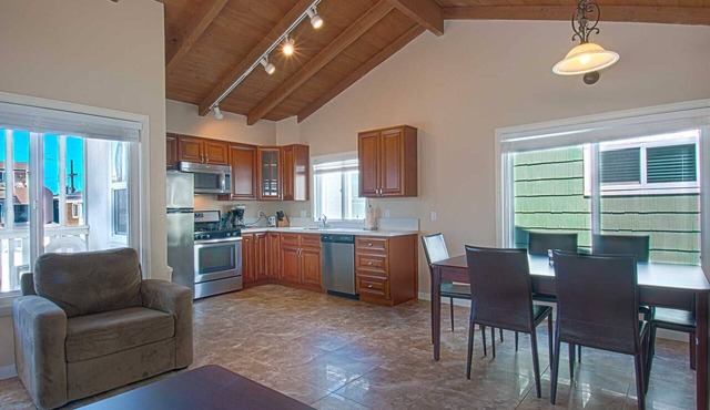 Fantastic and newly-remodeled upper unit just one house from the warm sand