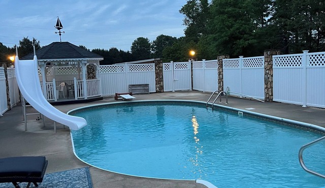 Spacious ranch-style home with tranquil pool and multiple entertainment areas