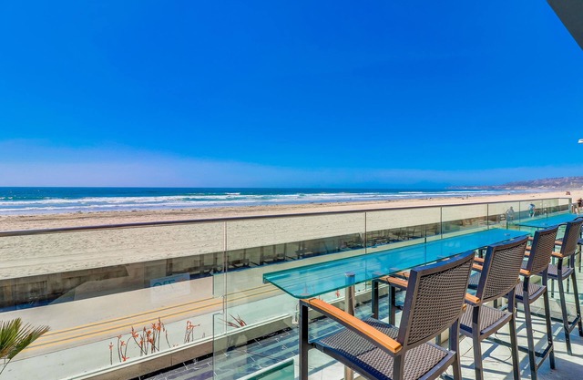 Oceanfront condo with private waterfront patio, washer/dryer, gas grill