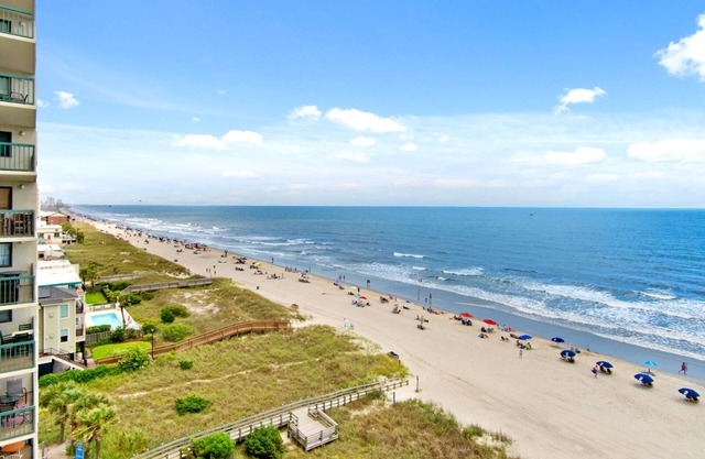 Oceanfront family-sized condo rental with lazy river, pool, and fitness center near Ocean Drive