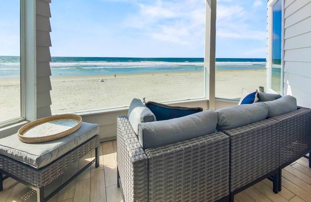 Upper level beachfront condo w/incredible views, gas fireplace, decks, & W/D