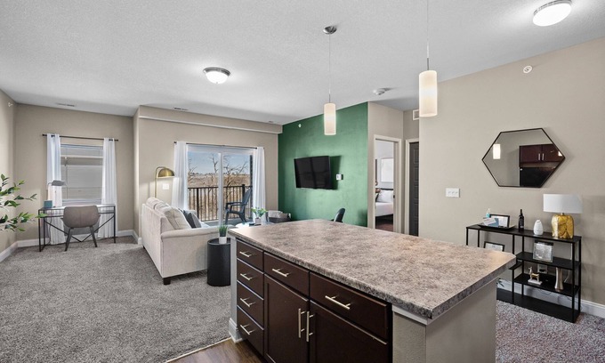 West Des Moines Apartment | Top Floor! Garage Included + New Onsite Gym!